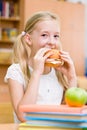 Schoolgirl eating fast food