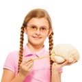 Schoolgirl in glasses holding cerebrum model