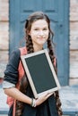 a schoolboy holding a chalk board Royalty Free Stock Photo