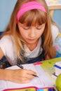 Schoolgirl learning to write Royalty Free Stock Photo