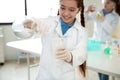 Schoolgirl making experiment in chemistry class