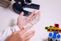 A schoolgirl with a microscope examines chemicals in test tubes, conducts experiments. The concept of coronavirus Royalty Free Stock Photo