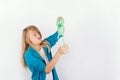 Schoolgirl playing with green slime looks like gunk Royalty Free Stock Photo