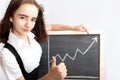 Schoolgirl pointing to line graph