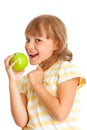 Schoolgirl portrait eating green apple isolated
