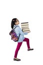 Schoolgirl posing step on staircase with books