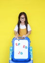 Schoolgirl present text EF, EQ and IQ on whiteboard. Asian little child girl present something on white board for study in class.