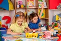 Schoolgirl raises her hand to answer. Royalty Free Stock Photo