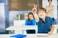 Schoolgirl raising hand