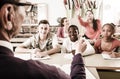 Schoolgirl raising hand to answer a lesson Royalty Free Stock Photo