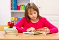 Schoolgirl reading book Royalty Free Stock Photo