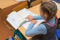 Schoolgirl reading condition problems in the textbook