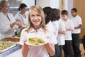 Schoolgirl in a school cafeteria Royalty Free Stock Photo