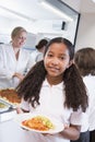 Schoolgirl in a school cafeteria Royalty Free Stock Photo