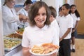 Schoolgirl in a school cafeteria Royalty Free Stock Photo