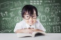 Schoolgirl with scribble background on the chalkboard Royalty Free Stock Photo