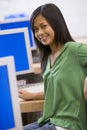 Schoolgirl sitting in front of a computer Royalty Free Stock Photo