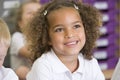 Schoolgirl sitting in primary class