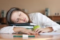 Schoolgirl is sleeping with her books at lesson Royalty Free Stock Photo