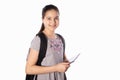 Schoolgirl smiles, holds a tablet in her hands and looks away