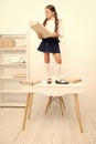 Schoolgirl stand table work archive folder. Cute little bookworm. Pupil studying history read archive document. Search