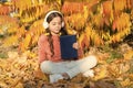 Schoolgirl study. Child enjoy reading. Visual and audio information. Little child enjoy learning at backyard. Kid study