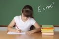 Schoolgirl studying at the classroom Royalty Free Stock Photo