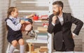 Schoolgirl studying in classroom with teacher. Father explaining homework to his daughter at home. Doing homework with Royalty Free Stock Photo