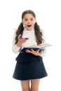 Schoolgirl with surprised look isolated on white. Little child hold book with pen. Back to school. Home schooling Royalty Free Stock Photo