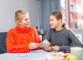 Schoolgirl taking money from her mother Royalty Free Stock Photo