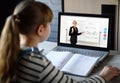 Schoolgirl and teacher learn a physics lesson using video chat on laptop. Video conference with the tutor at home. Online distance