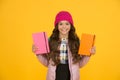 Schoolgirl with textbooks. Little smiling girl hold books. Future textbooks modern education. Textbook useful in