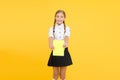 Schoolgirl wear school uniform. Knowledge day. Girl with copy book or workbook. Kid student ready with homework. School Royalty Free Stock Photo