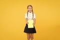 Schoolgirl wear school uniform. Knowledge day. Girl with copy book or workbook. Kid student ready with homework. School Royalty Free Stock Photo