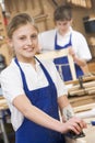 Schoolgirl in woodwork class Royalty Free Stock Photo