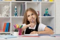 schoolgirl writing. school girl with notebook. back to school. teen girl ready to study.