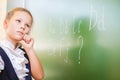 Schoolgirl wrote in chalk on blackboard and teach English language