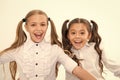 Schoolgirls with cute ponytails hairstyle and brilliant smiles. Best friends excellent pupils. Perfect schoolgirls tidy Royalty Free Stock Photo