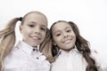 Schoolgirls with cute ponytails hairstyle and brilliant smiles. Best friends excellent pupils. Perfect schoolgirls with Royalty Free Stock Photo