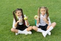 Schoolgirls eating apples relaxing schoolyard, refuse to eat concept
