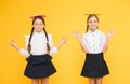 Schoolgirls friends studying together. Kids school uniform hold books. Life balance. Dealing with school stress