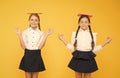 Schoolgirls friends studying together. Kids school uniform hold books. Life balance. Dealing with school stress