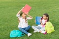 Schoolgirls little children school yard with books, learning language concept Royalty Free Stock Photo