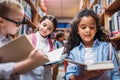 beautiful little schoolgirls looking for books