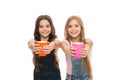 Schoolgirls with mugs having tea break. Relax and recharge. Water balance concept. Enjoying tea together. Sisters or Royalty Free Stock Photo