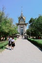 Schoolgirls walking from the memorial tower in the Cambodia Killing Fields Choeung Ek Genocidal Center Phnom Penh Royalty Free Stock Photo