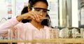 Schoolkid examining chemical in laboratory 4k