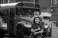 Schoolkid getting on the school bus. American School. Back to school. Kid of primary school. Happy children ready to Royalty Free Stock Photo