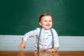 Schoolkid or preschooler learn. Elementary school. Cute preschooler with funny face schooling work. Portrait of