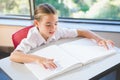 Schoolkid reading braille book in classroom Royalty Free Stock Photo